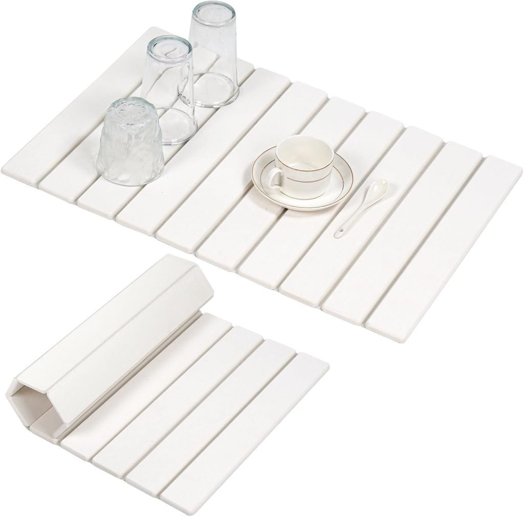 Two white slatted drying mats, one flat holding cups and glasses, the other rolled up, displayed on a white background—perfect for upgrading your kitchen during Amazon Prime Big Deal Days.