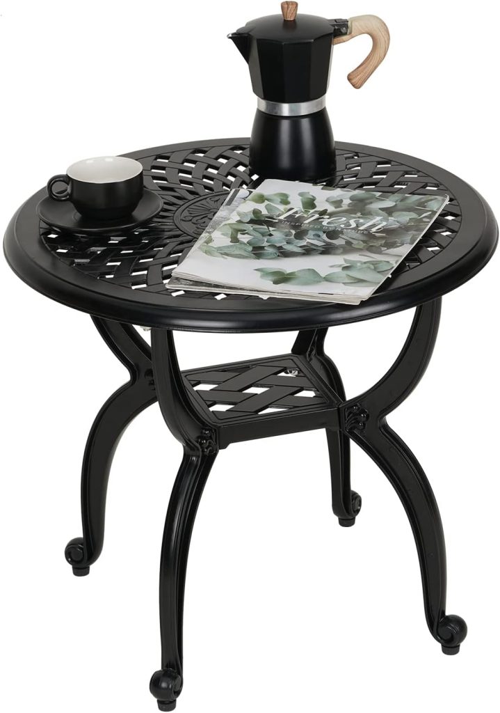 A black round metal table at this inviting Airbnb in Waco is set with a cup and saucer, a stovetop coffee maker, and an open magazine on top.