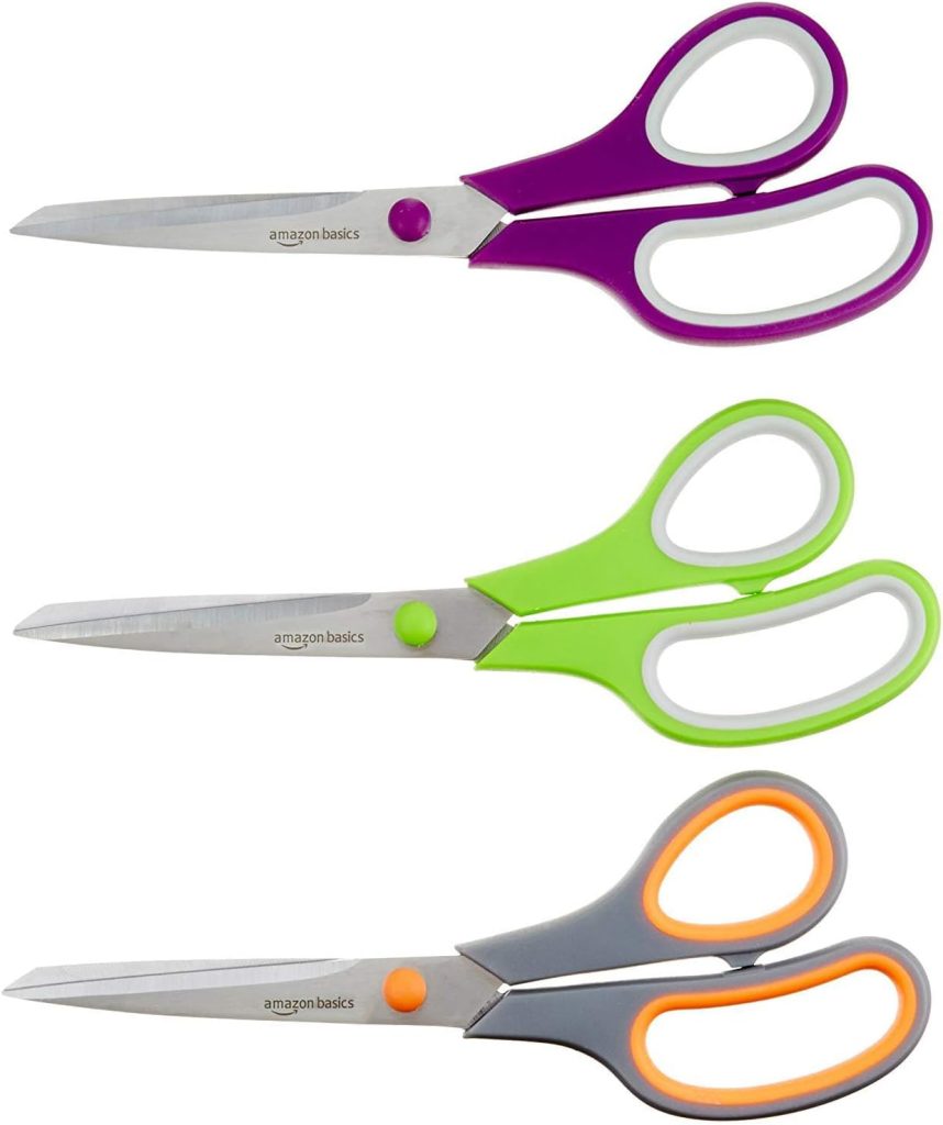 Three pairs of scissors with stainless steel blades and colored plastic handles in purple, green, and orange, arranged in a vertical row—perfect for crafting Glitter Christmas Trees.