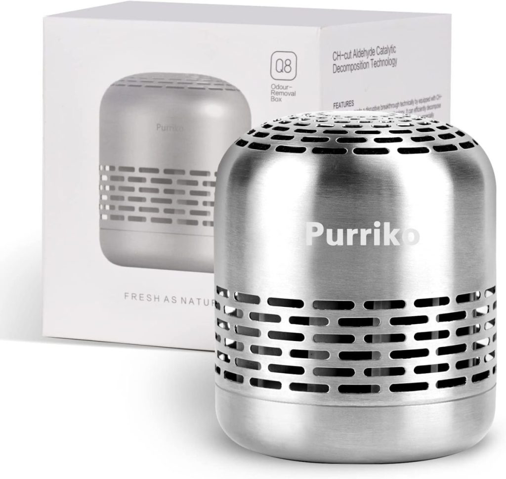 A stainless steel Purriko air purifier with its packaging displayed in the background. The device features a vented design, branding on the front, and is available during Amazon Prime Big Deal Days.
