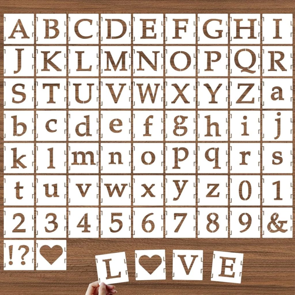A set of white stencil tiles with uppercase letters, lowercase letters, numbers, and symbols, arranged on a wooden surface; "LOVE" is spelled with stencils at the bottom.