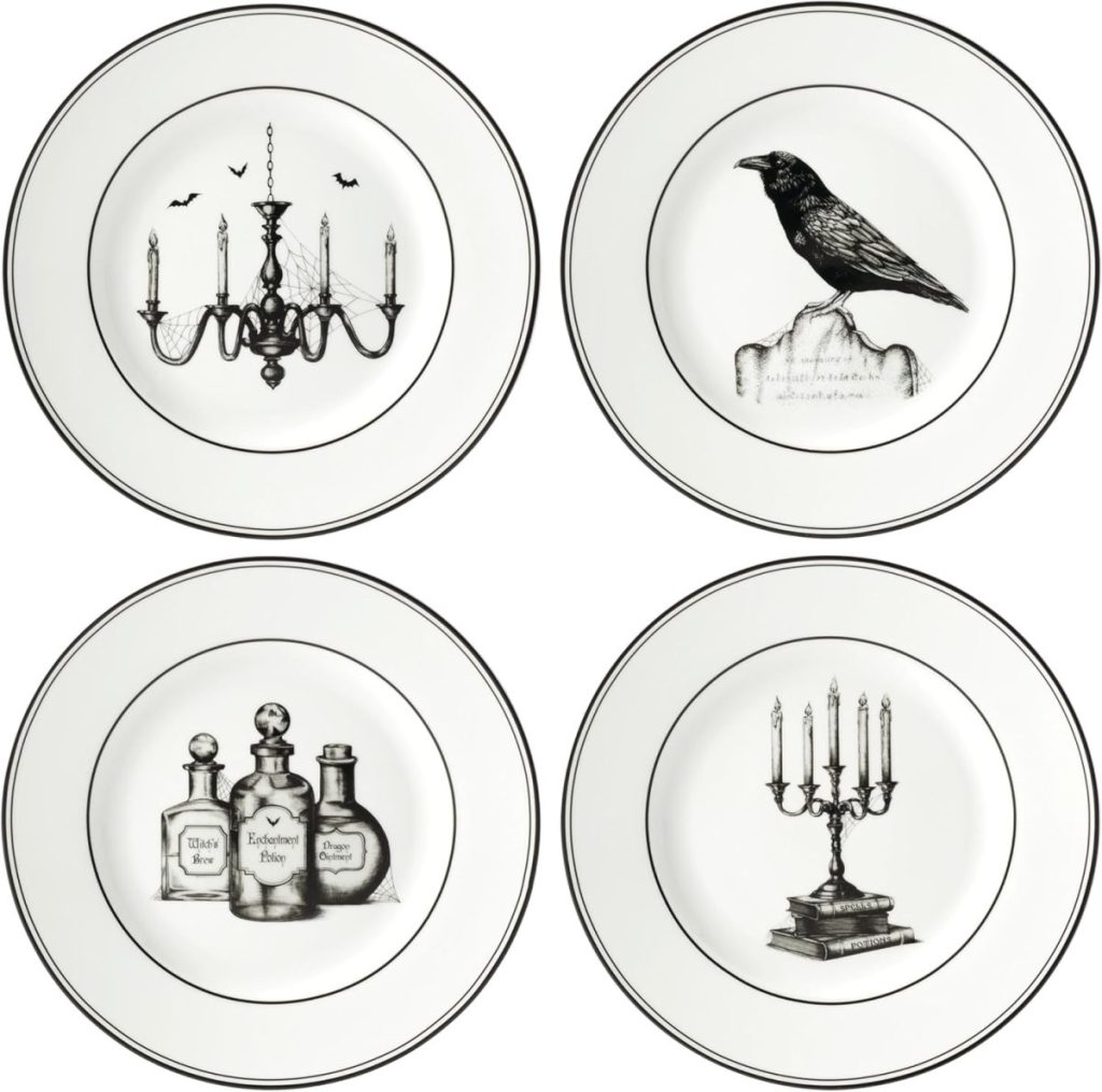Set of four white plates with black illustrations: a chandelier with bats, a raven on a stone, vintage potion bottles, and a candelabra on stacked books—perfect for adding a touch of whimsy to your holiday season gatherings.
