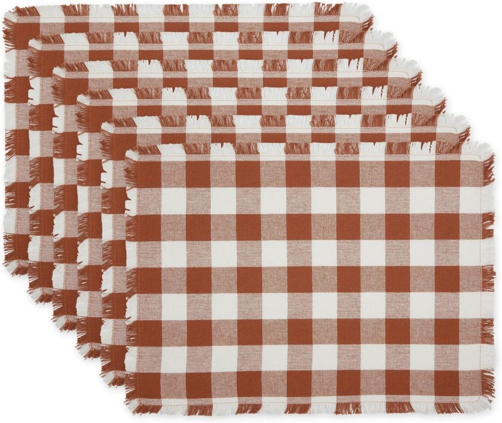 Set of five rectangular placemats with a brown and white gingham check pattern and fringed edges, stacked in a slightly fanned arrangement—perfect for refreshing your table décor during Amazon Prime Big Deal Days.