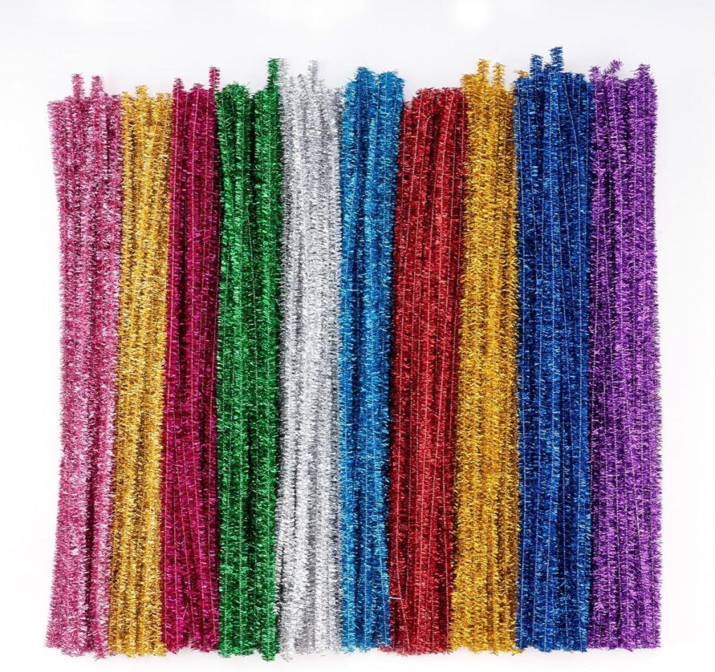 A group of colorful pipe cleaners arranged vertically in rows, including red, pink, green, gold, silver, blue, and purple—ideal for crafting Glitter Christmas Trees—set against a white background.
