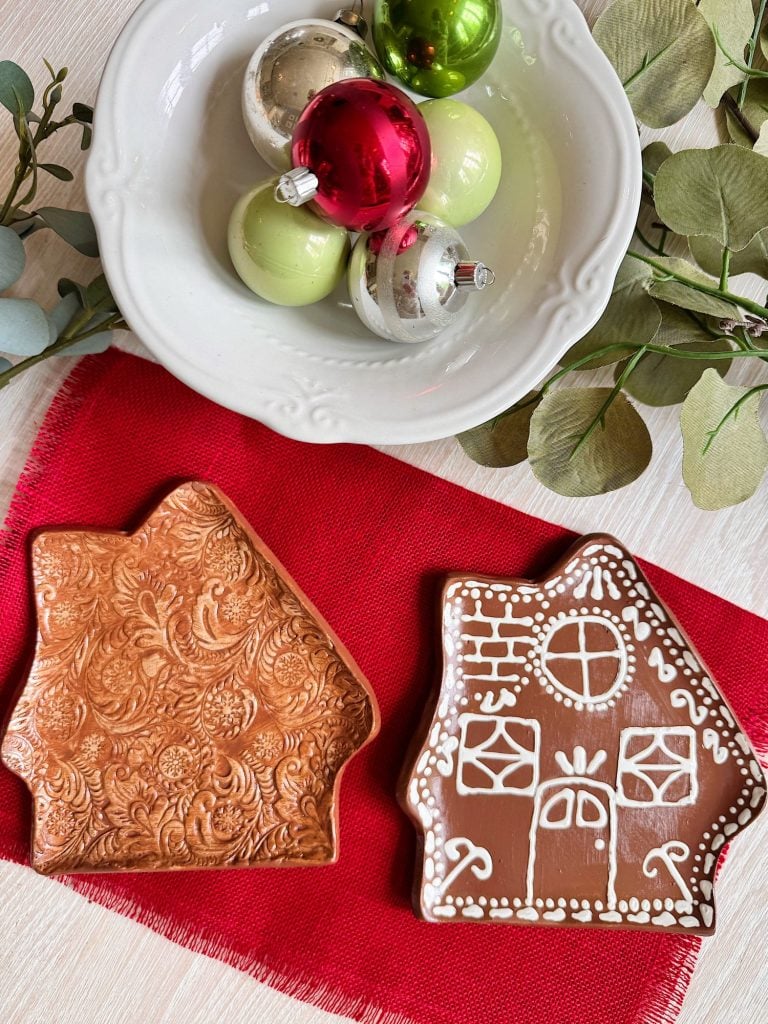 A plate of gingerbread cookies and ornaments.