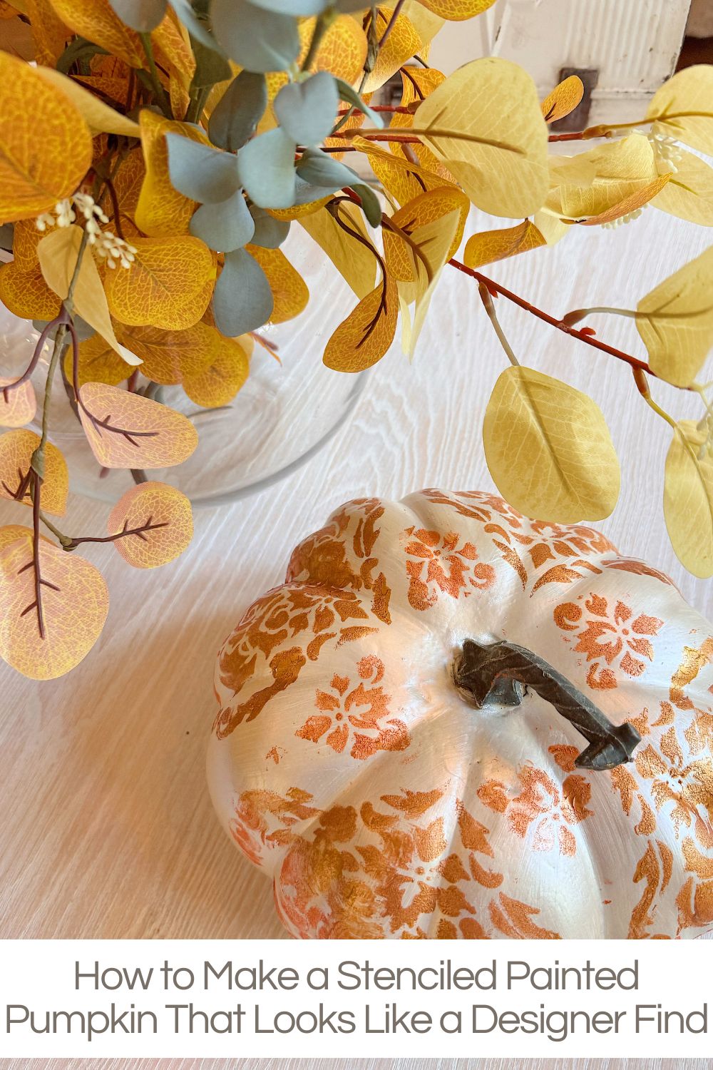 I love taking something inexpensive and transforming it into a piece that looks like it came from a high-end store. That’s precisely what happened with this stenciled painted pumpkin project.
