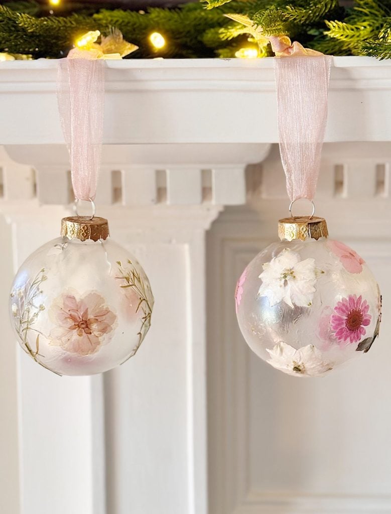 Two ornaments on a shelf.