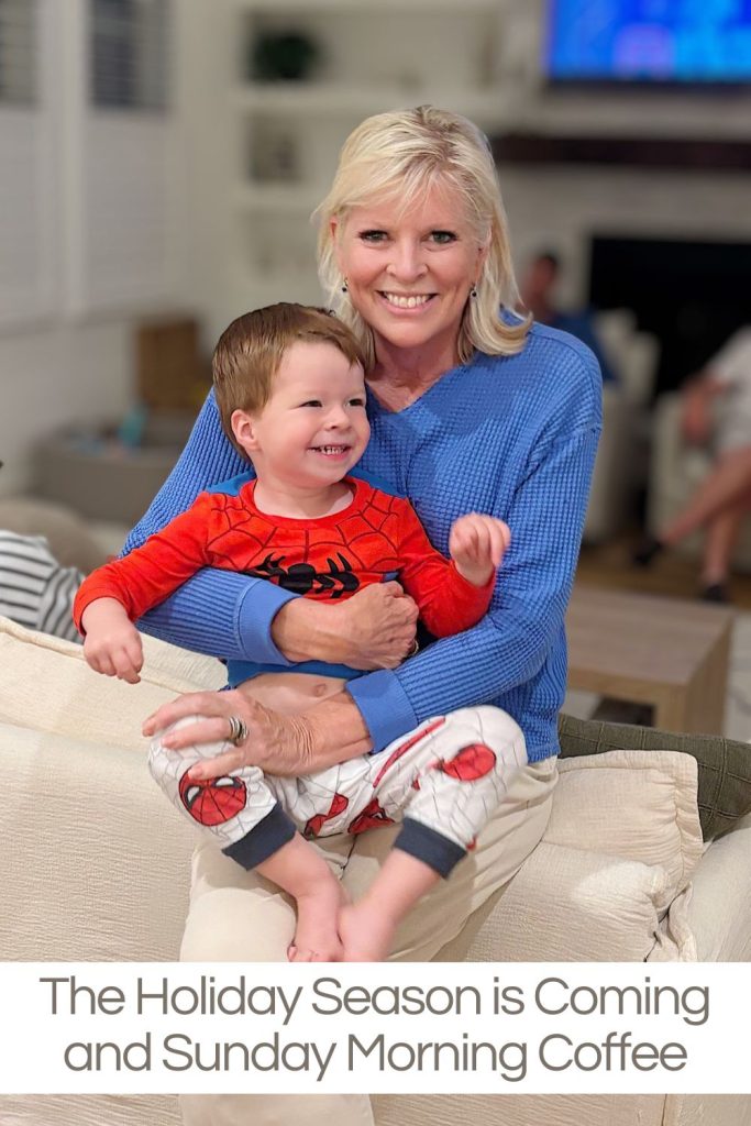 A woman in a blue sweater sits on a couch holding a smiling young boy in Spider-Man pajamas. Text at the bottom reads, "The Holiday Season is Coming and Sunday Morning Coffee.