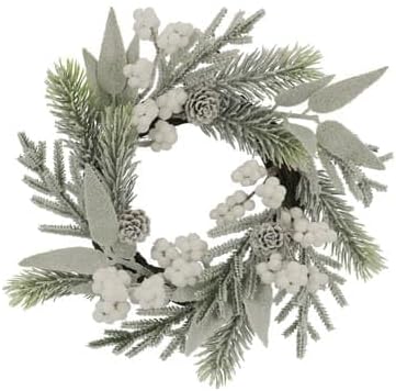 A circular wreath made of pine branches, white berries, small pinecones, and frosted leaves, arranged in a winter holiday style.