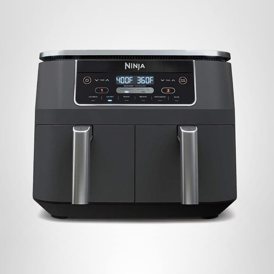 A black Ninja dual-basket air fryer with digital display showing 400°F and 360°F, two control panels, and two silver handles, set against a plain white background.