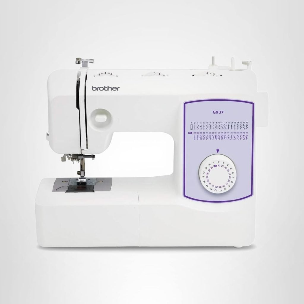 A white Brother GX37 sewing machine with a stitch selection dial and stitch pattern guide on the front, set against a plain gray background.