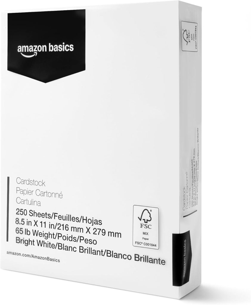A ream of Amazon Basics bright white cardstock, 8.5 x 11 inches, 250 sheets, 65 lb weight, with multilingual text on the packaging.