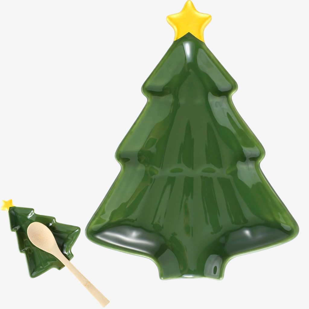A green ceramic dish shaped like a Christmas tree with a yellow star at the top, and a matching small dish with a wooden spoon.