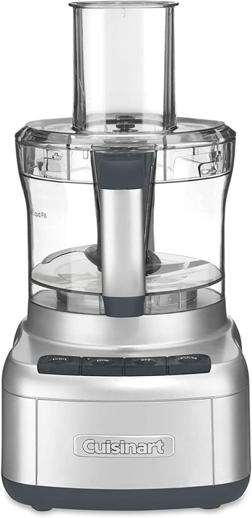 A silver Cuisinart food processor with a clear plastic bowl, feed tube, and black control buttons on the front&mdash;perfect for creating recipes or prepping ingredients for your next blog posts.