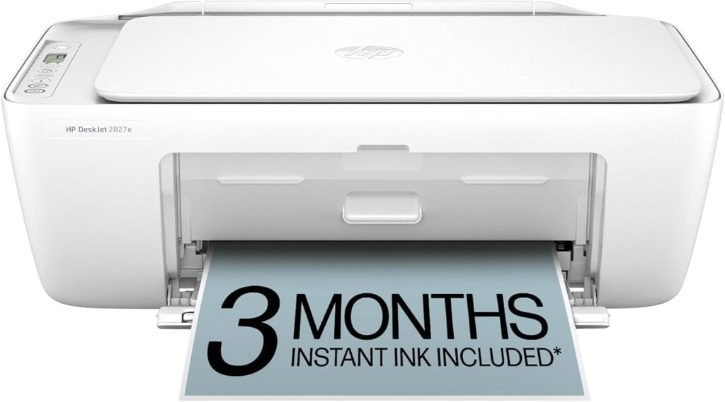 White HP DeskJet 2827e printer printing a paper that reads "3 MONTHS INSTANT INK INCLUDED*" in large bold text, perfect for creating vibrant window art or everyday documents.