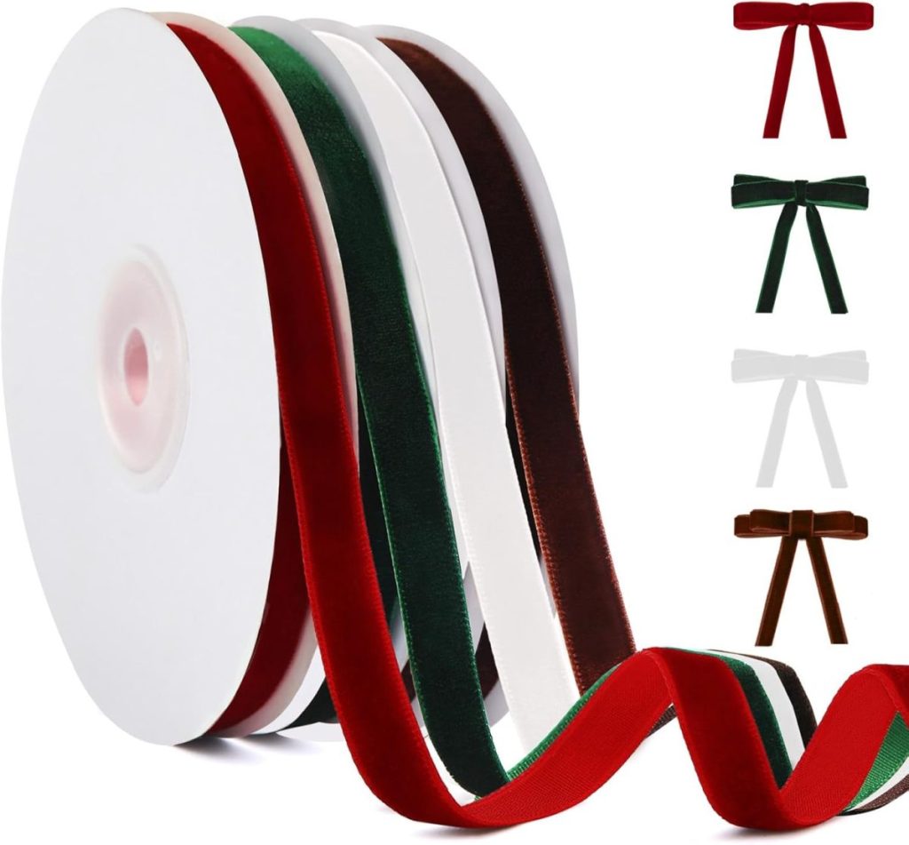 Three spools of velvet ribbon in red, green, and brown with matching bows in the same colors and a white bow displayed on the right side.