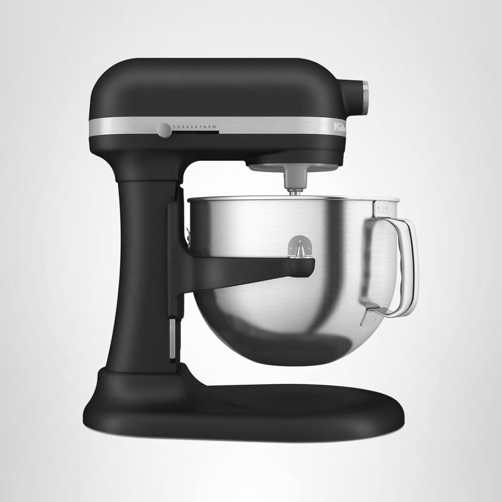 A black stand mixer with a large stainless steel mixing bowl attached, perfect for creating recipes inspired by your favorite blog posts, set against a plain light background.