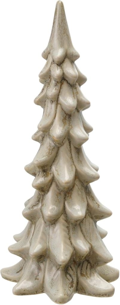 A ceramic ornament shaped like a stylized evergreen tree with a light beige, textured finish.
