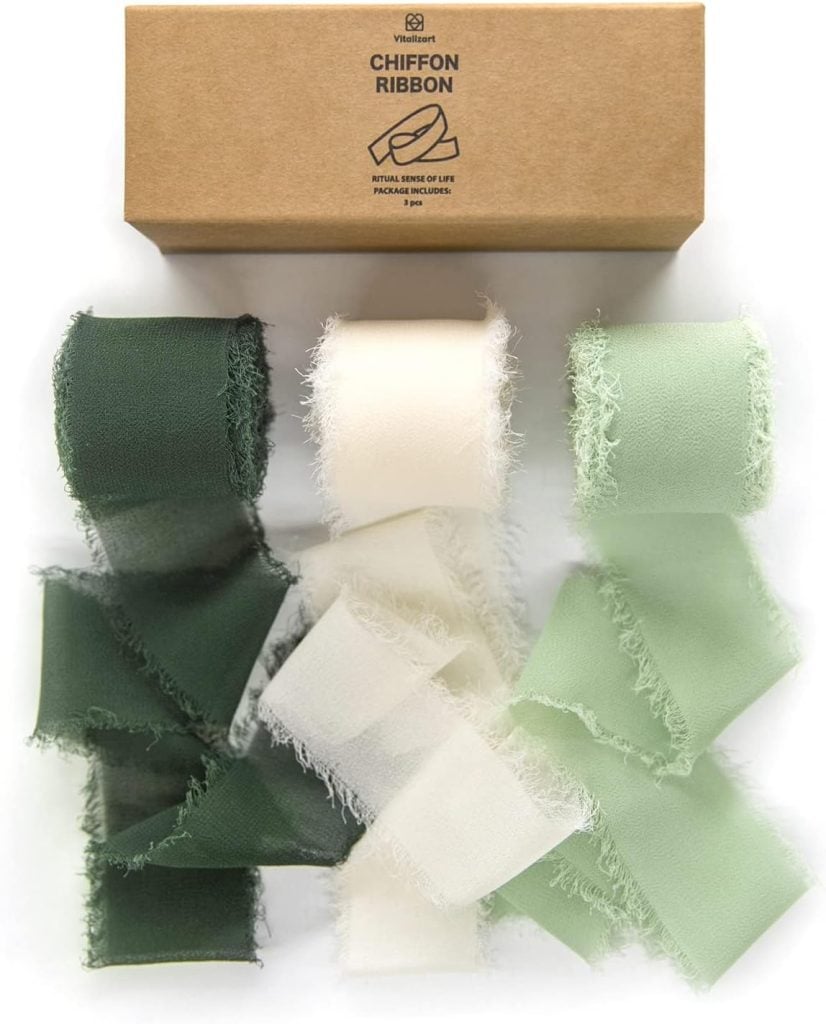Three rolls of frayed chiffon ribbon in dark green, cream, and light green are arranged below a brown box labeled "Chiffon Ribbon.