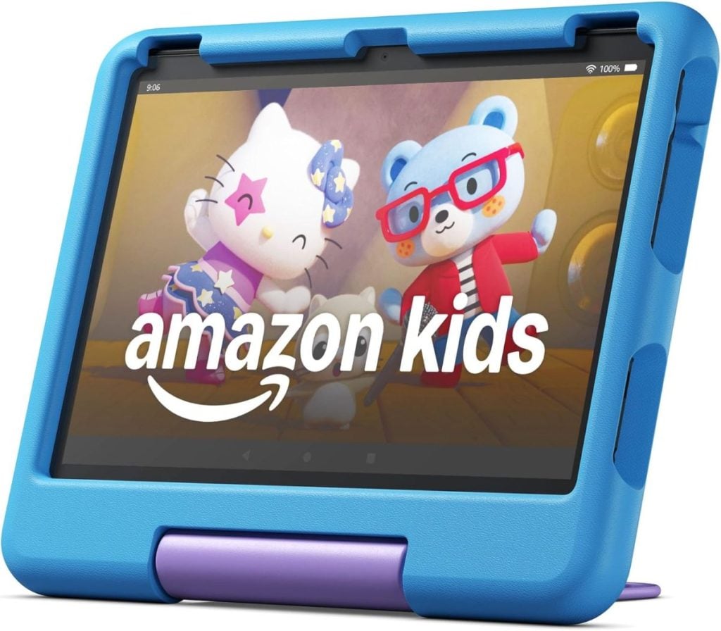 A tablet in a blue protective case displays the Amazon Kids app, showing animated characters, including a cat and a bear, on the screen.