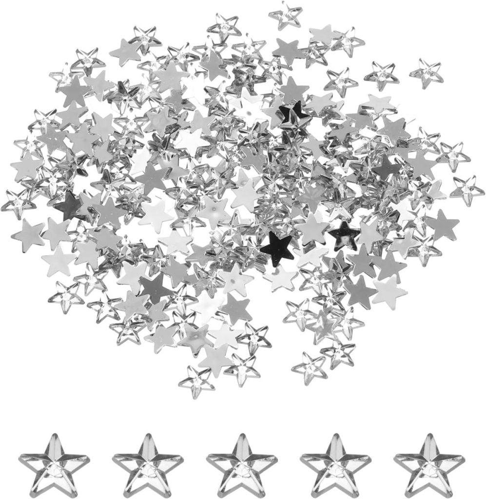A pile of small silver star-shaped confetti pieces, with five individual stars displayed in a row at the bottom of the image.