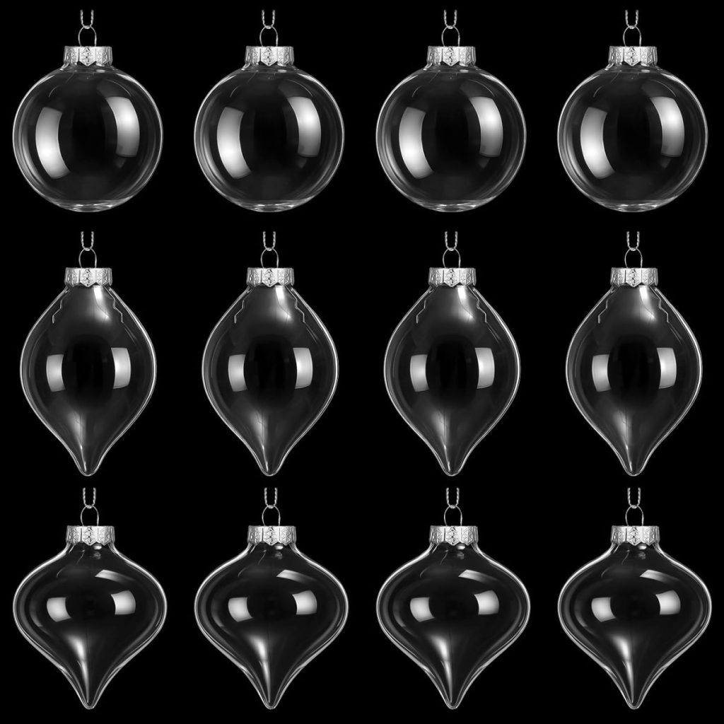 A grid of twelve clear glass Christmas ornaments in three elegant shapes, arranged in four rows and three columns on a black background—perfect as a sophisticated hostess gift.