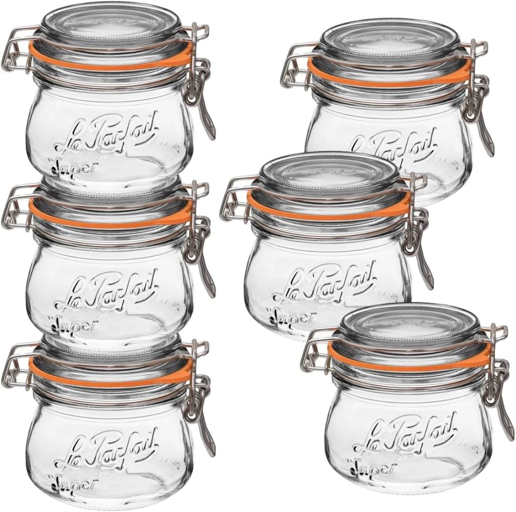 Six clear glass jars with orange rubber seals and metal clasp lids, arranged in two rows, each jar labeled "Le Parfait Super.