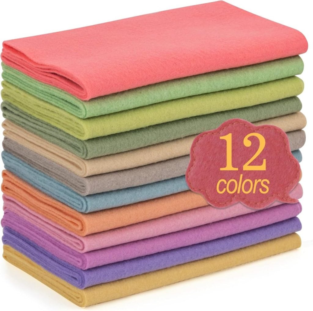 A stack of twelve neatly folded fabric sheets in different colors with a label reading "12 colors" on the side.