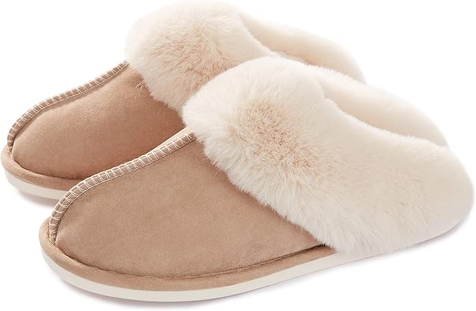 A pair of beige slip-on slippers with plush, fuzzy lining and closed toes, placed side by side on a white background.