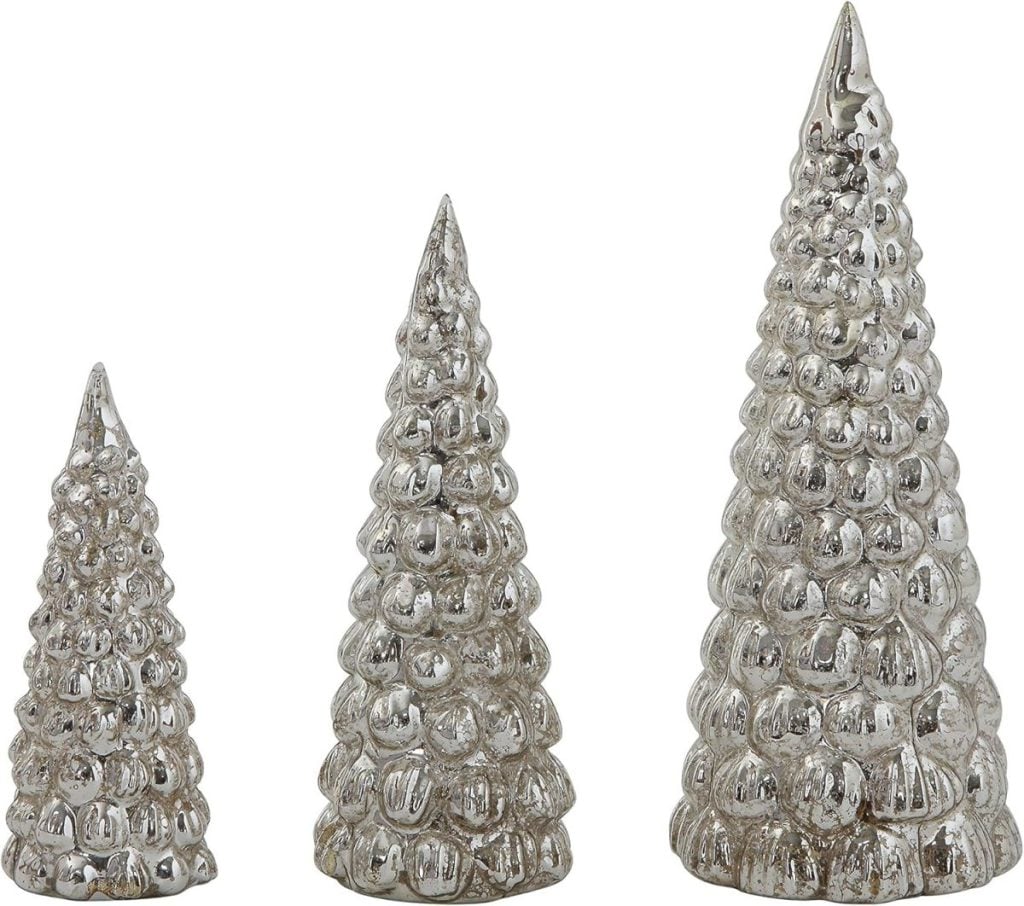 Three silver, textured, cone-shaped decorative objects resembling stylized Christmas trees, arranged in ascending height from left to right against a white background.