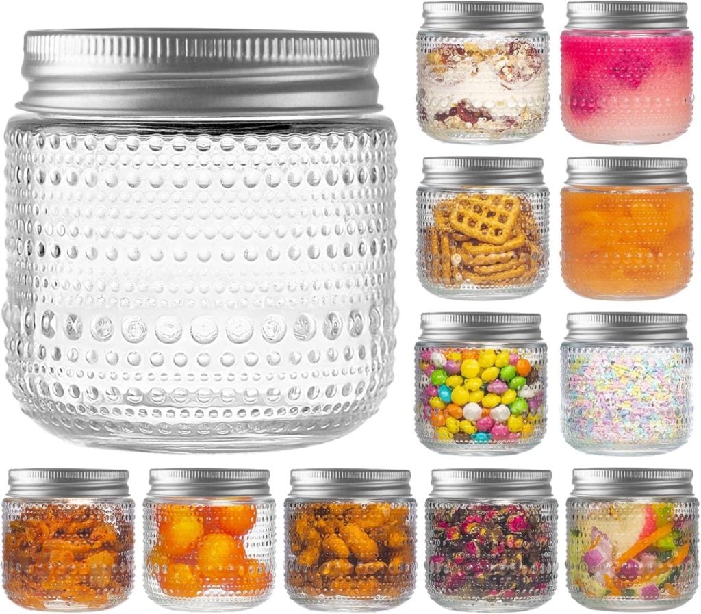 A set of twelve clear, textured glass jars with silver lids, shown empty and filled with various snacks and desserts.