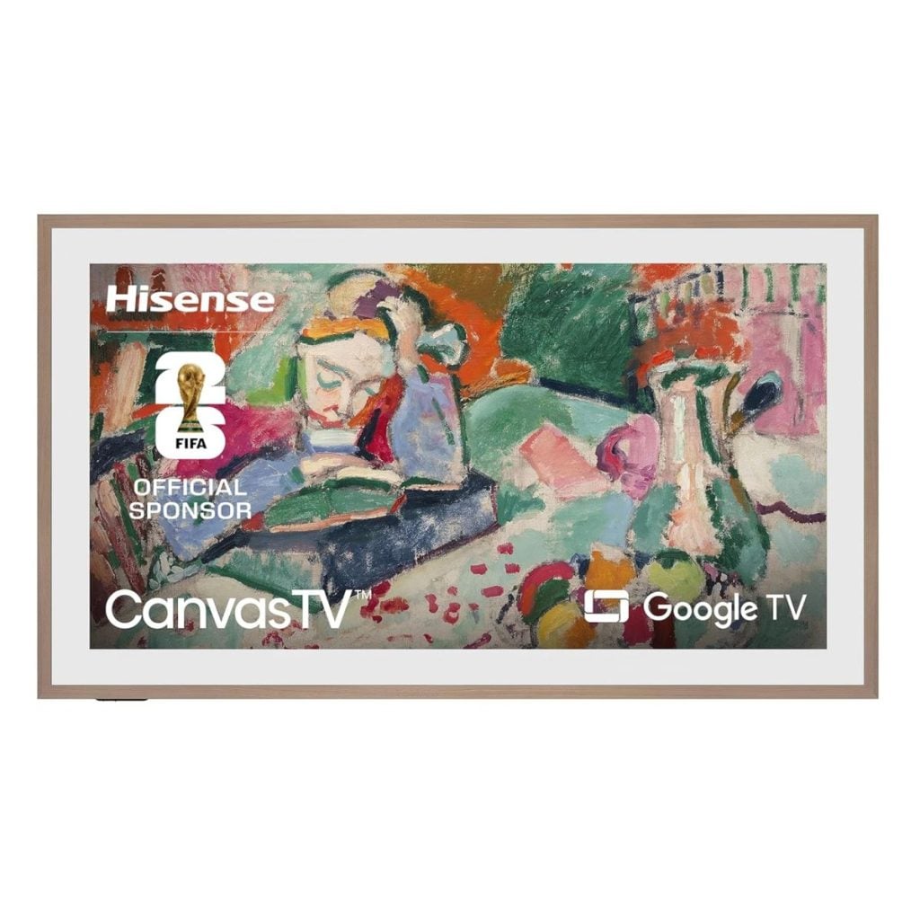 A Hisense CanvasTV displaying a colorful abstract painting, with logos for FIFA, Hisense, CanvasTV, and Google TV visible on the screen—perfectly complementing a cozy living room with a festive Christmas pillow.