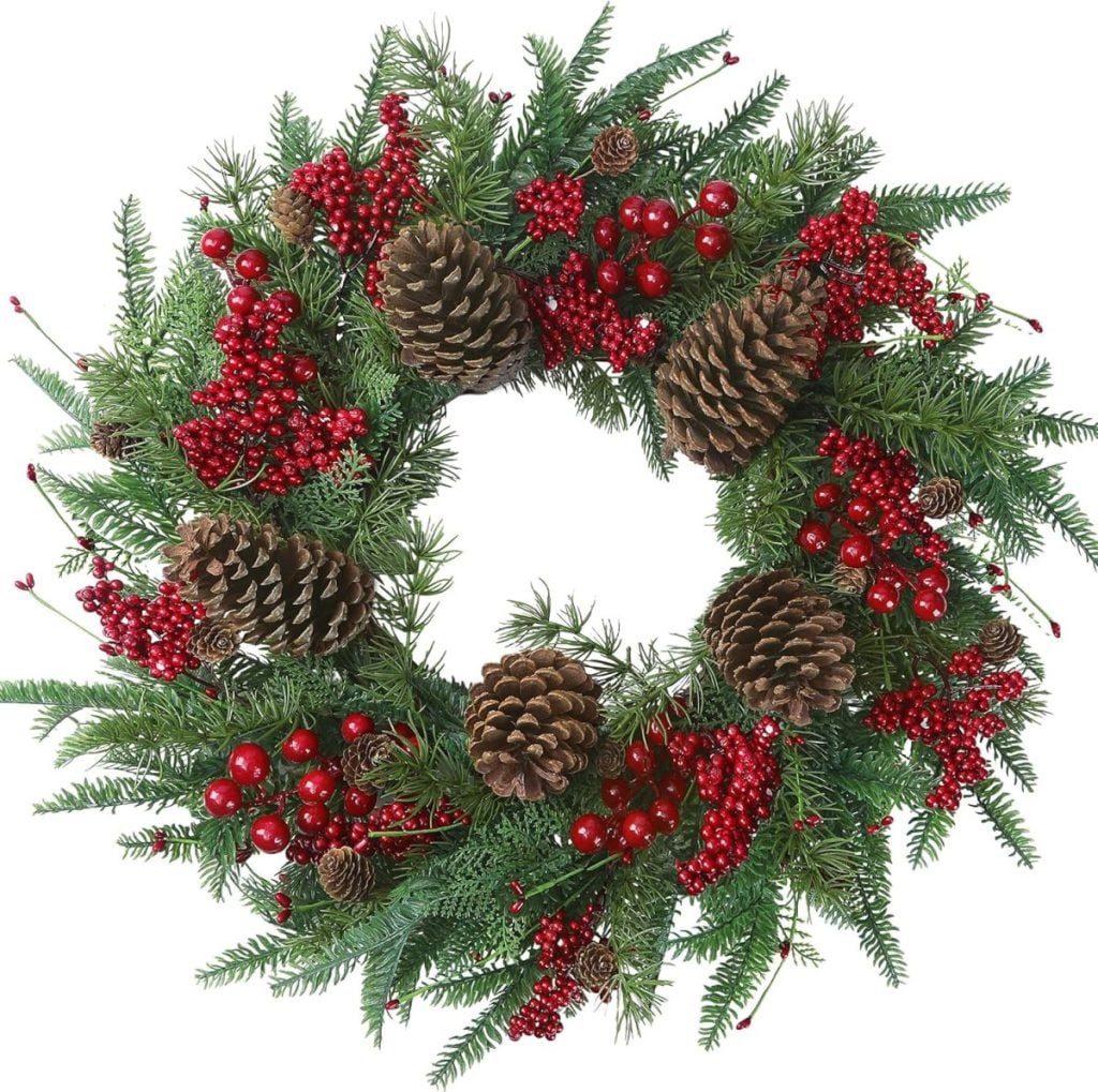 A Christmas wreath made of green pine branches, red berries, and pinecones arranged in a circle on a white background, perfect for festive window art displays.