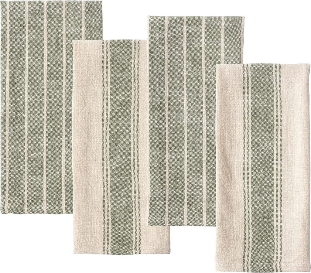 Four beige and green striped cloth napkins are neatly laid out side by side against a white background.