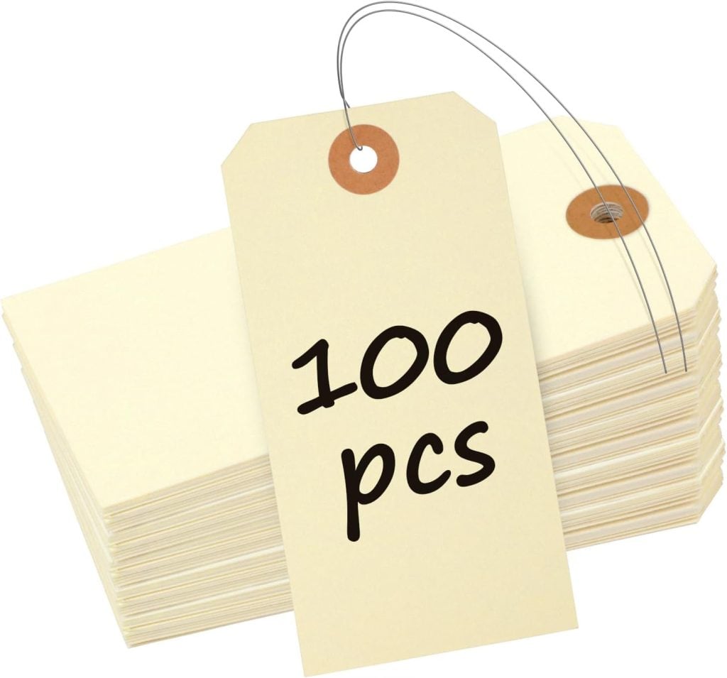 A stack of blank beige tags with a string, and one tag labeled "100 pcs" in black text is shown on top.