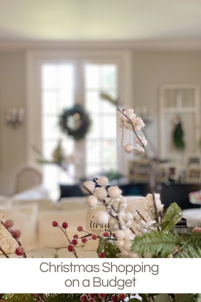 A holiday-themed living room with festive decorations and a "Christmas Shopping on a Budget" text banner at the bottom.