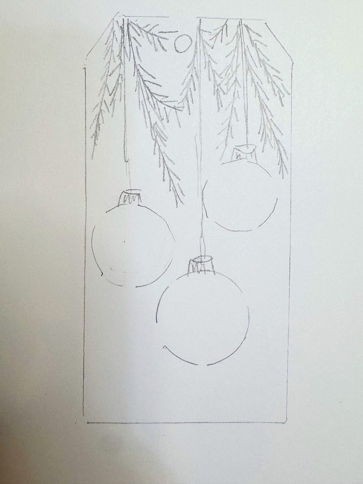 Pencil sketch of three hanging ornaments and pine branches on a rectangular tag.