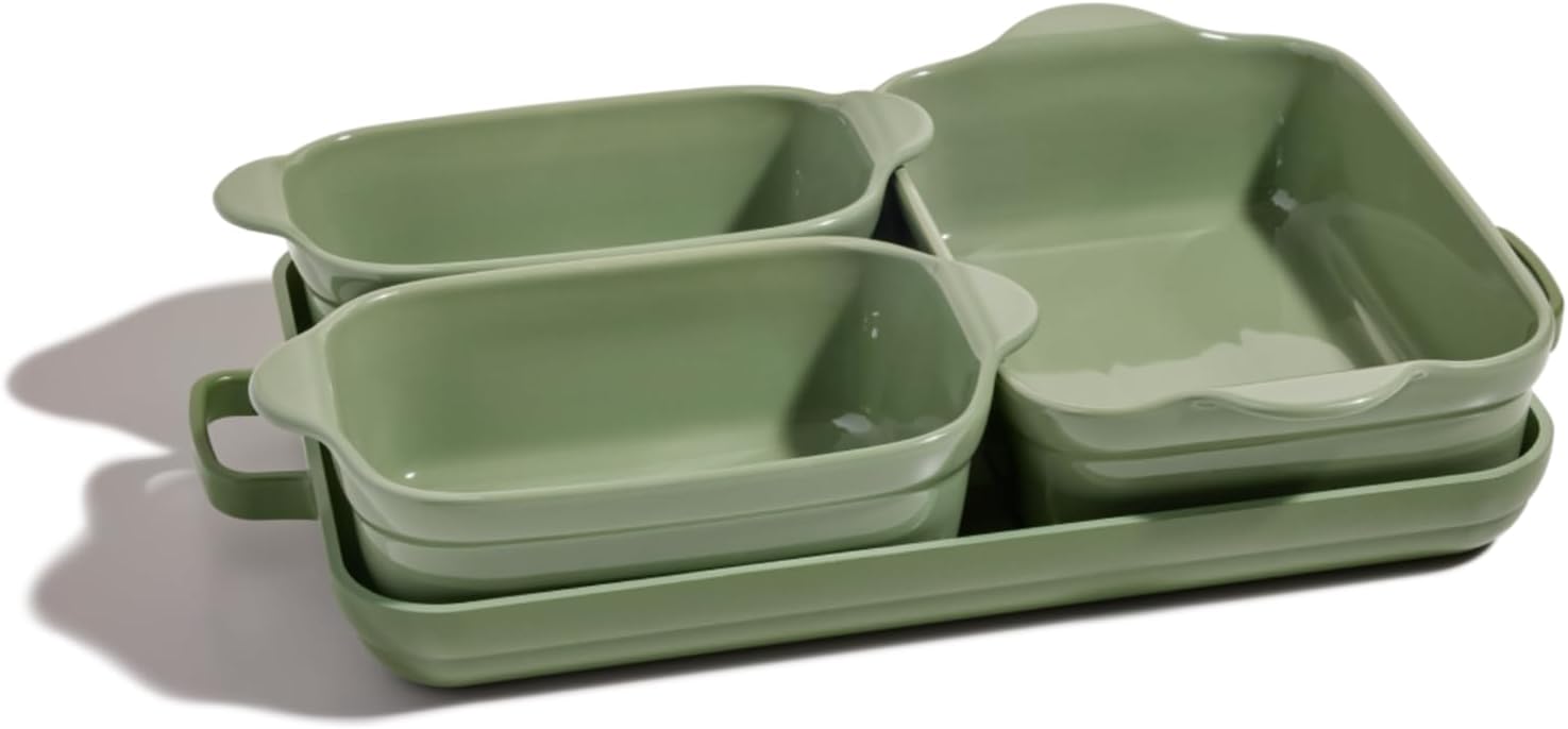 A set of four green ceramic baking dishes of different sizes, nested together with handles on the sides—perfect for trying new recipes and adding baking to your Things To Do This Year list.