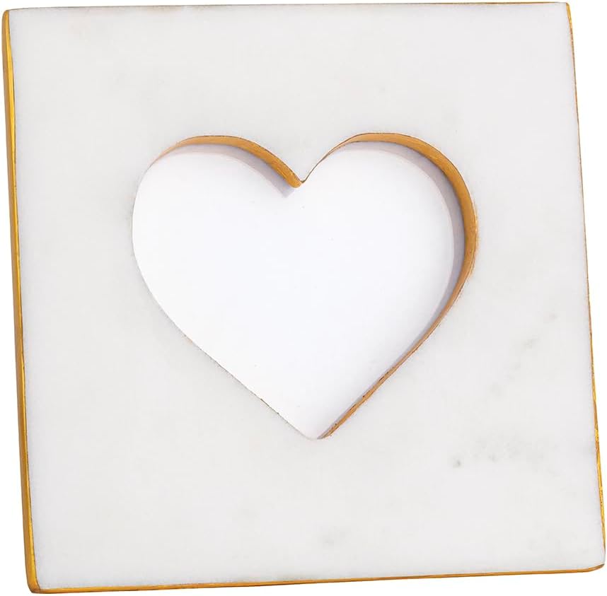 A square white marble tile with a heart-shaped cutout in the center and gold accents along the edges of the cutout.