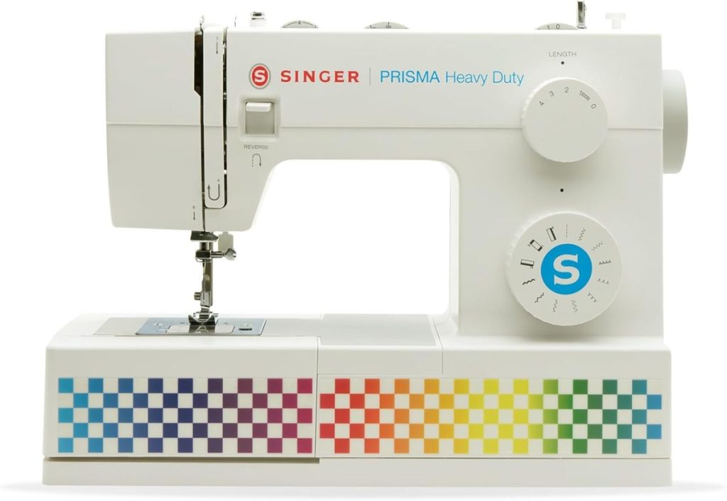 A white Singer Prisma Heavy Duty sewing machine with a rainbow checkerboard pattern on the lower front panel.