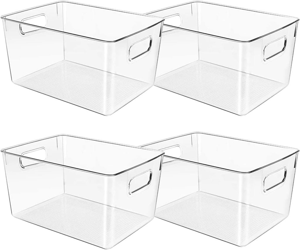 Four clear rectangular plastic storage bins with handles are shown side by side on a white background.