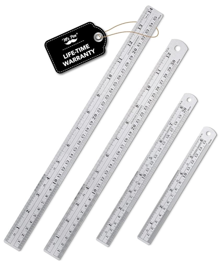Four stainless steel rulers of varying lengths are arranged on a white background, with a black tag indicating a lifetime warranty.
