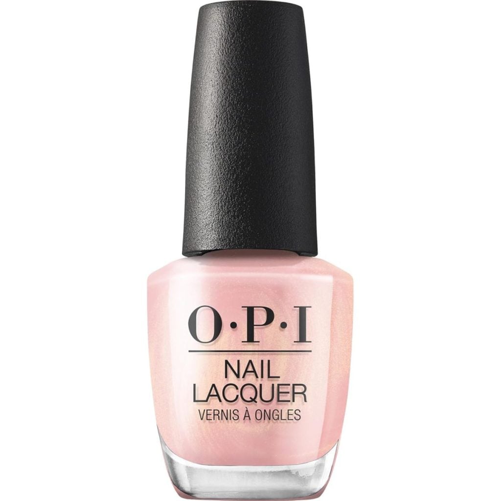 A bottle of OPI Nail Lacquer with a light pink polish and a black cap, labeled "Nail Lacquer Vernis &agrave; Ongles.