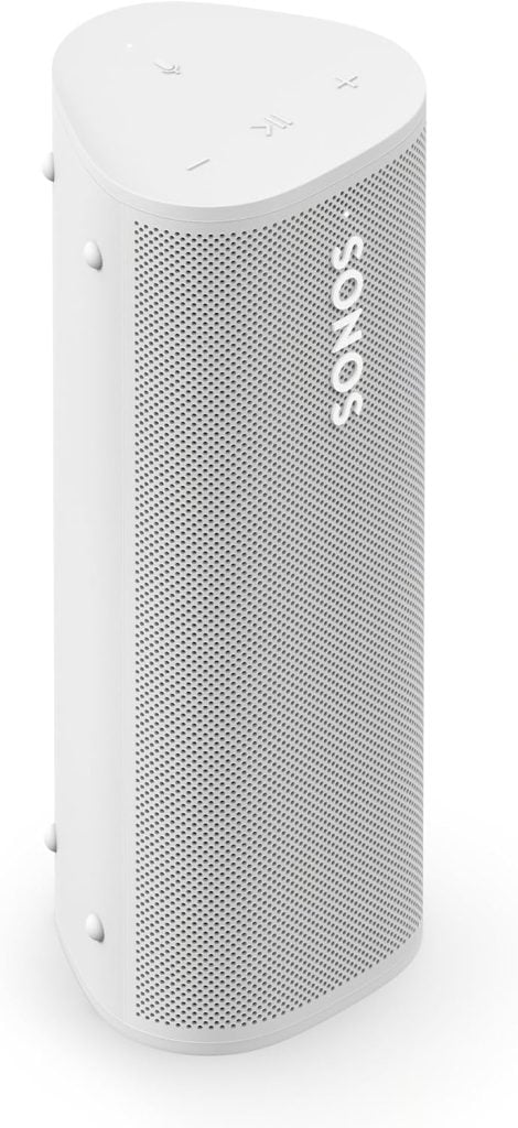 A white Sonos wireless speaker with a perforated front grille and control buttons on the top surface.
