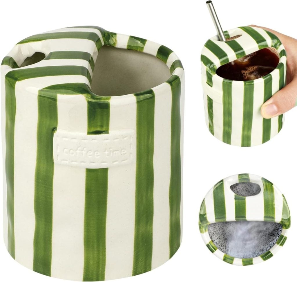 A green and white striped ceramic mug with a slot for holding a cup, shown with and without a drink inside, and a hand placing a straw into the cup.