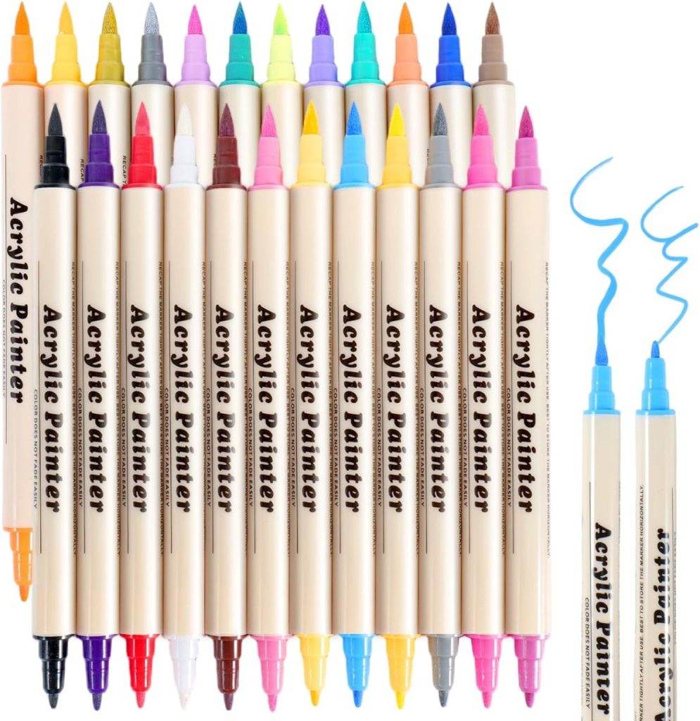 A set of 18 dual-tip acrylic paint markers in assorted colors, shown with both fine and brush tips, and two pens drawing blue lines.