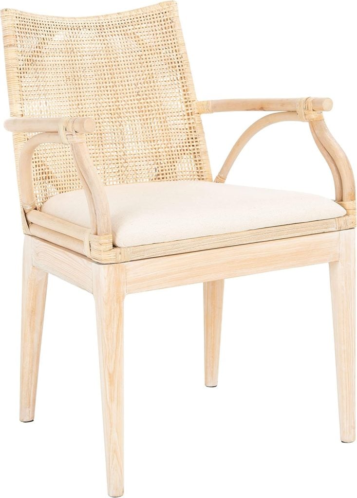 A light wood armchair with a woven rattan backrest and a cushioned beige seat, featuring straight legs and curved arm supports.