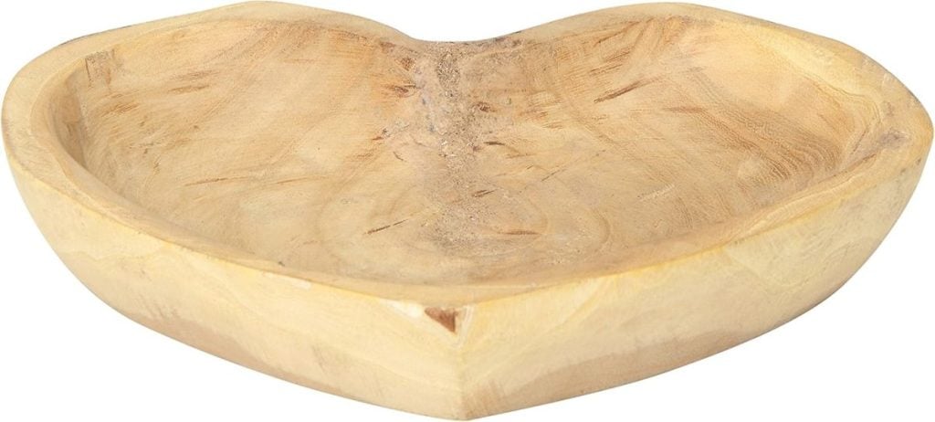 A shallow, heart-shaped wooden bowl with a natural, unfinished appearance.
