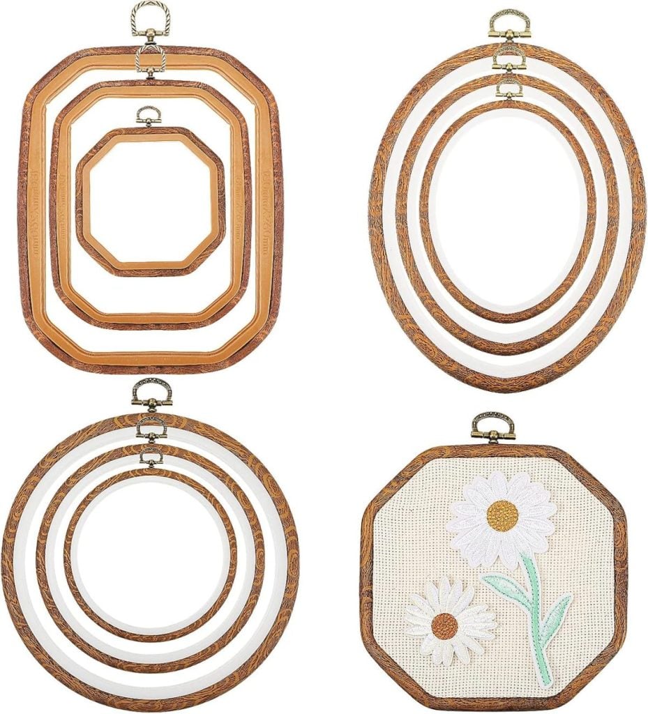 Four sets of embroidery hoops in circular, oval, square, and octagonal shapes, with one octagonal hoop displaying embroidered white flowers.