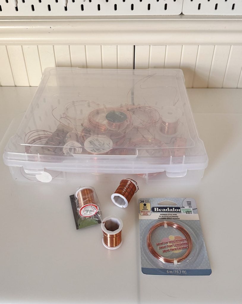 A plastic container with copper wire in it.